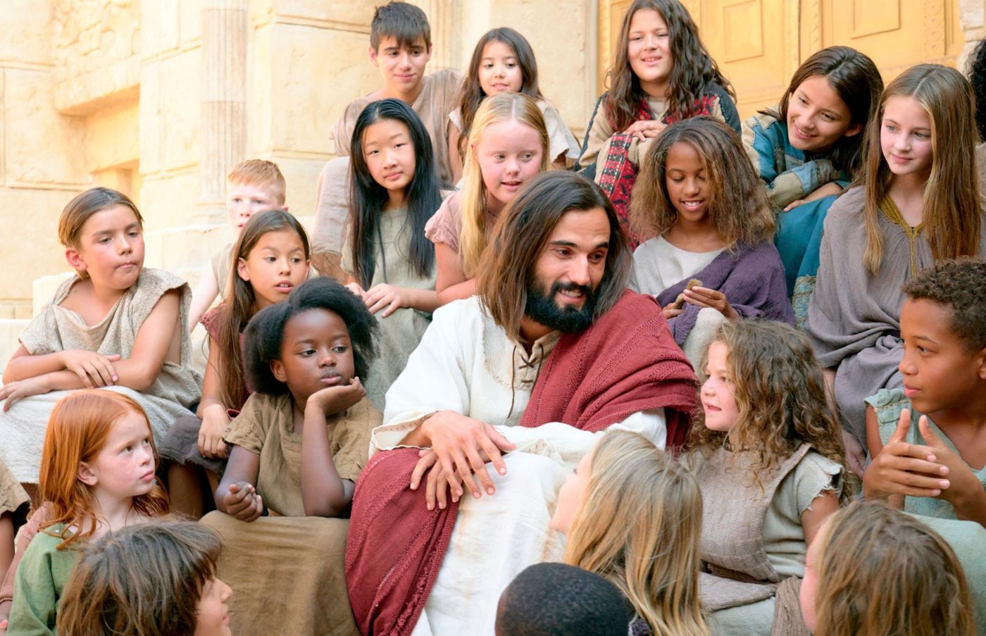 Jesus Christ portrayed seated among a group of children