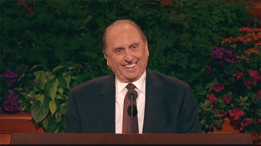 President Thomas S. Monson smiling at the pulpit during general conference