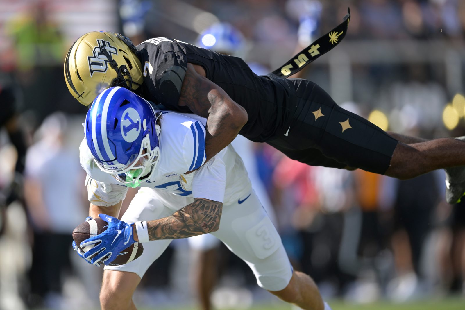 A BYU player and a UCF defender colliding in the end zone during the Oct. 24, 2026, game in Orlando