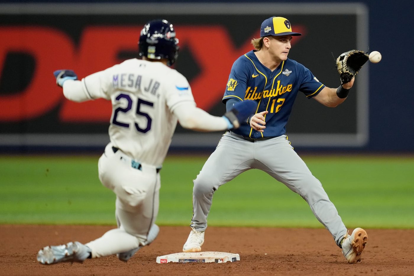 Milwaukee Brewers shortstop Cooper Pratt forcing out a Tampa Bay Rays runner at second base in Game 3 of the World Series